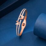 rose gold dual kada bracelet on aesthetic background stylish jewellery