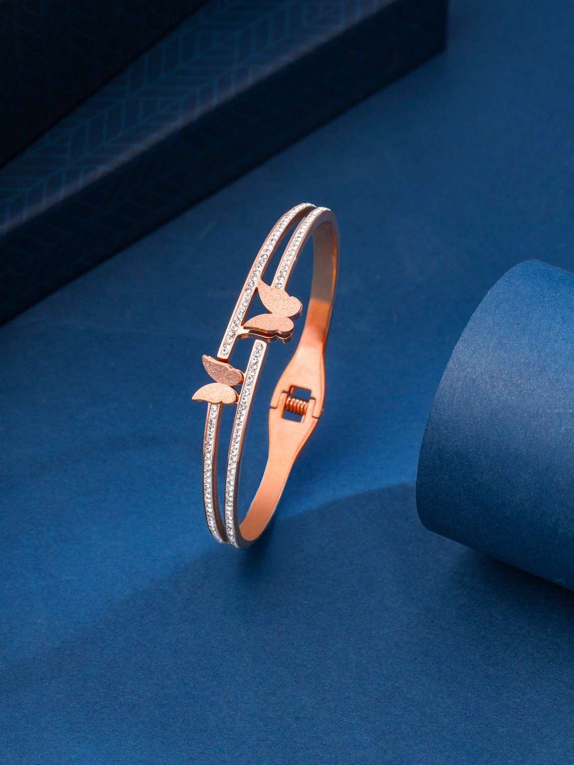 rose gold dual kada bracelet on aesthetic background stylish jewellery