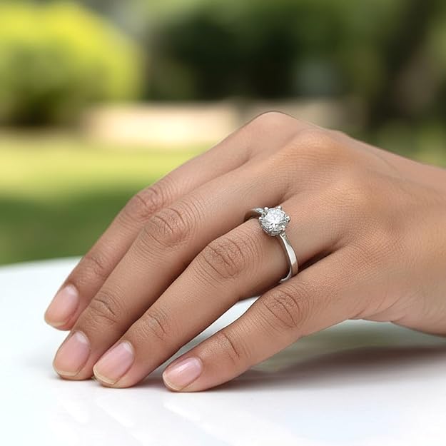 hand close up wearing 925 sterling silver ring with cubic zirconia