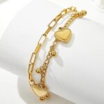 gold heart charm bracelet styled on aesthetic object display elegant jewellery