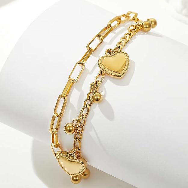 gold heart charm bracelet styled on aesthetic object display elegant jewellery