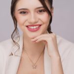 woman wearing pink butterfly pendant necklace with face visible aesthetic jewelry gold chain for women soft girl style