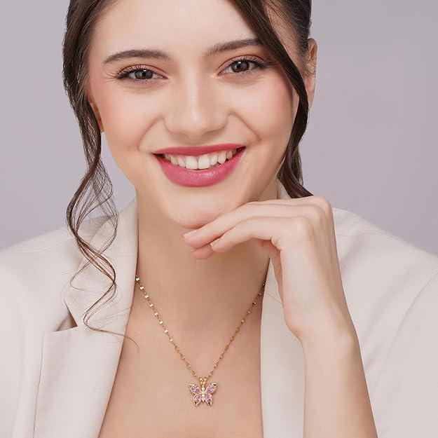 woman wearing pink butterfly pendant necklace with face visible aesthetic jewelry gold chain for women soft girl style
