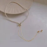 close up silver butterfly pendant on gold chain necklace