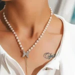 different woman wearing gold chain silver butterfly pendant necklace styled look